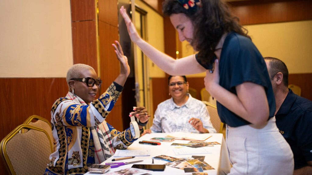 Masterclass photo - Addis Ababa March 2024 ICA Workshop - attendees smiling and high-fiving